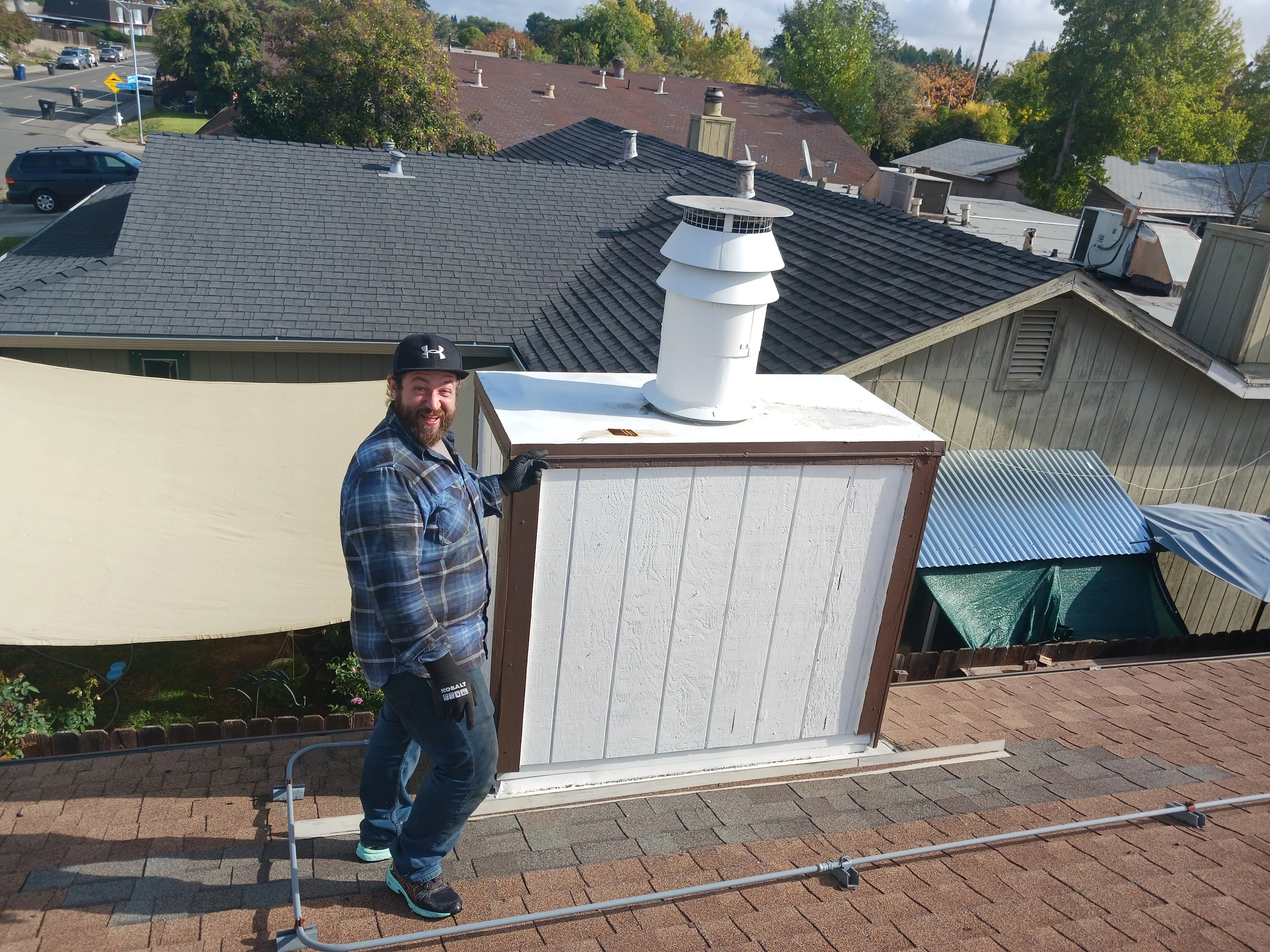 Chimney Guys INC certified technician performing a chimney inspection in Carmichael CA