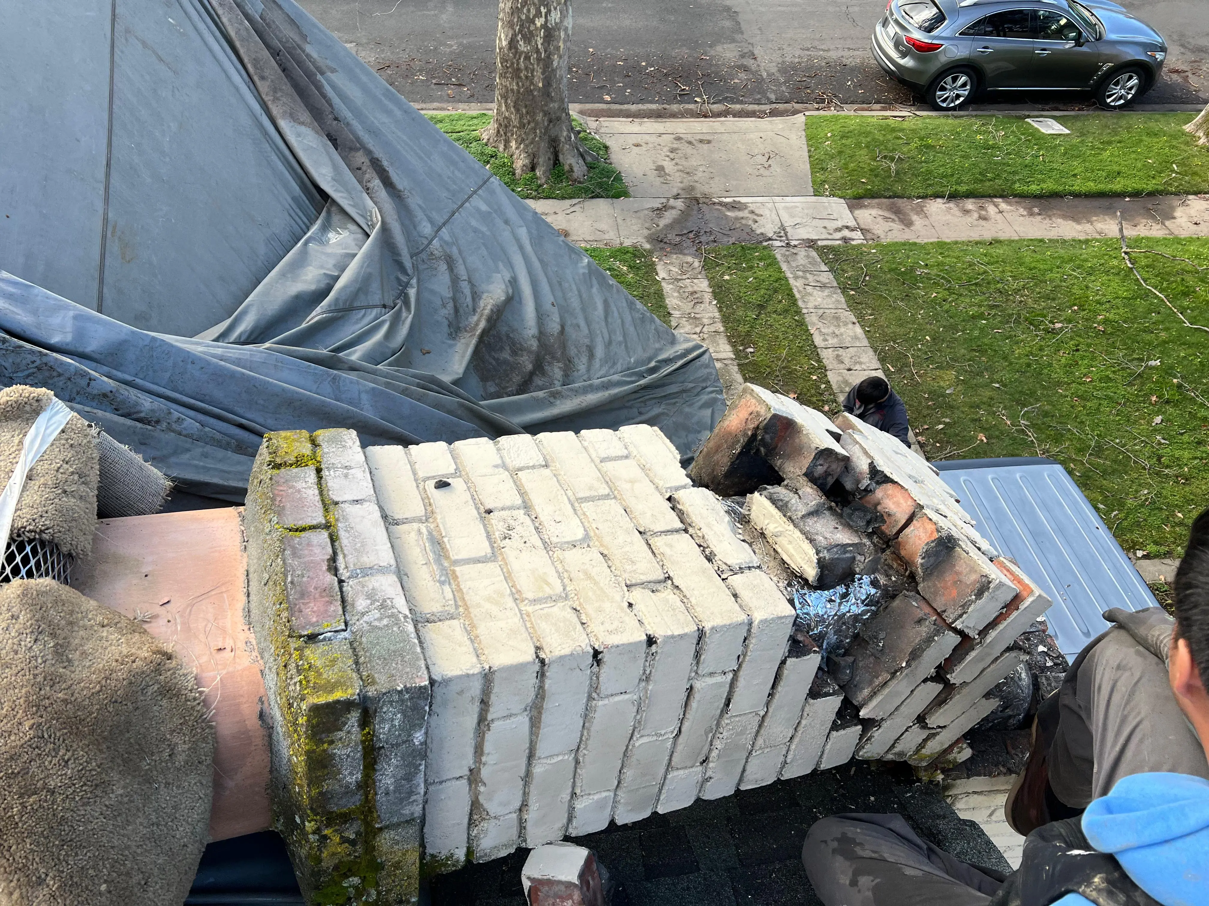 Chimney Guys INC mason performing tuckpointing and chimney repair in Carmichael CA