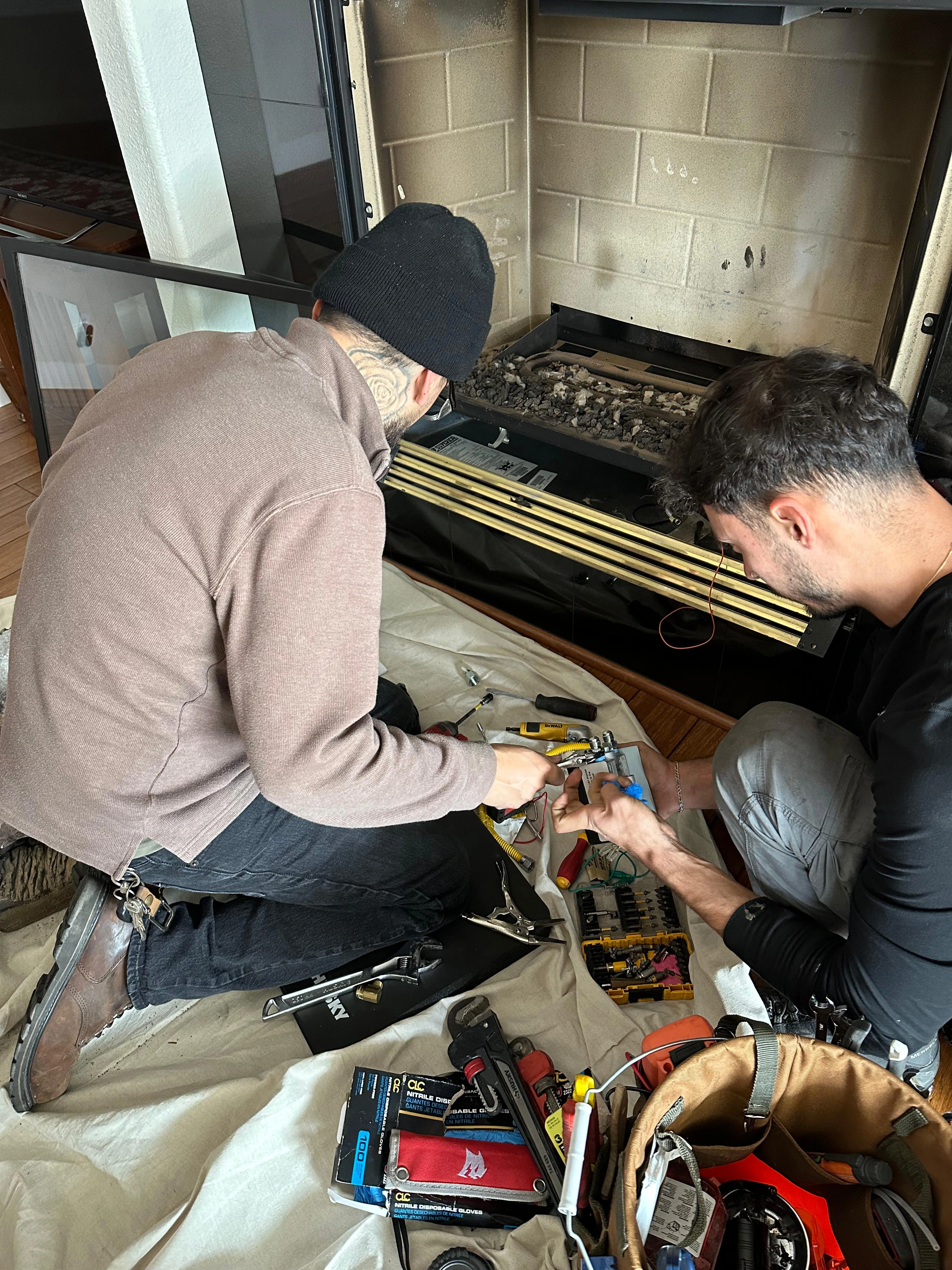Chimney Guys INC certified technician performing fireplace services in Carmichael CA